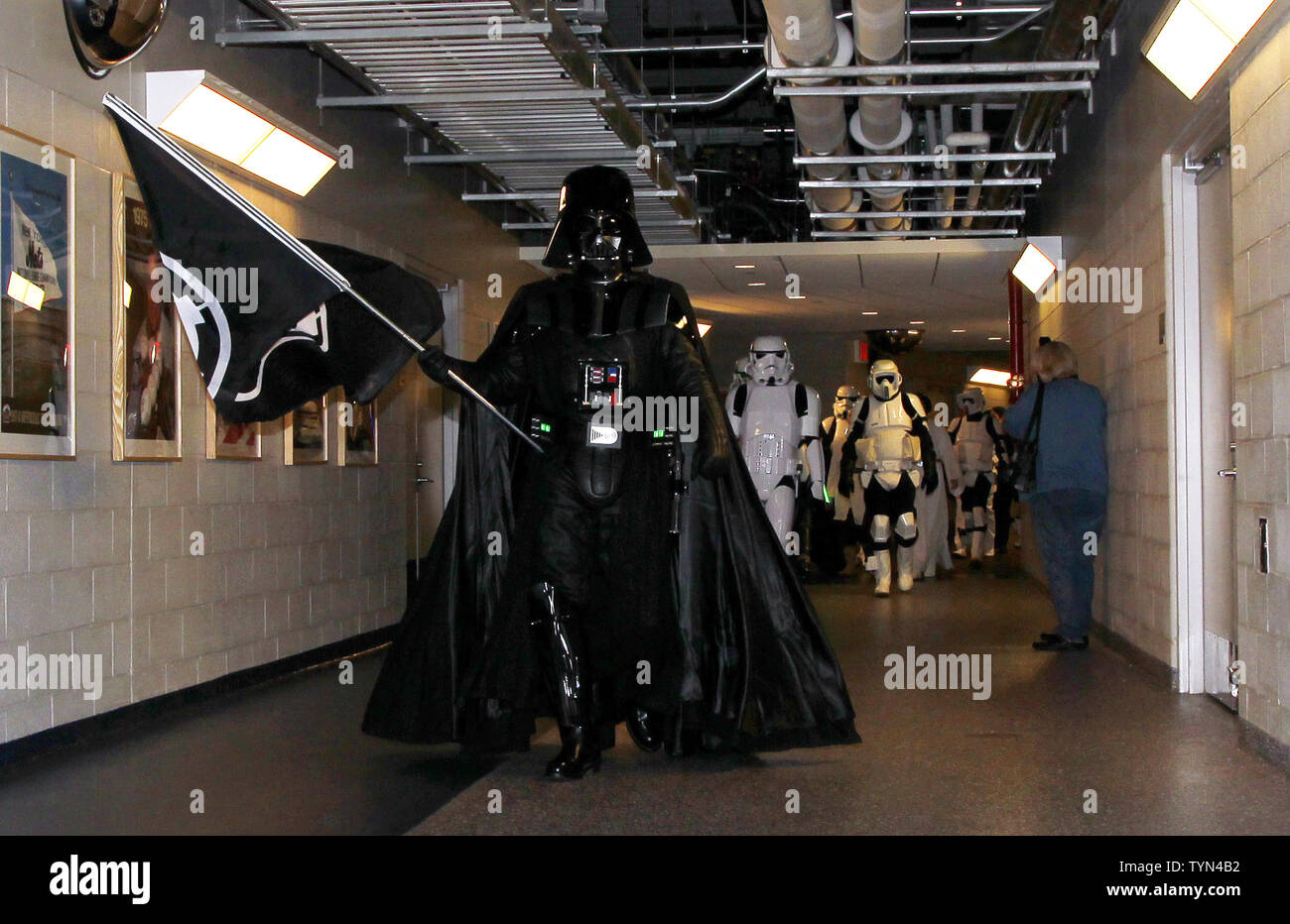 Darth Vader and the rest of the characters from Star Wars walk down the