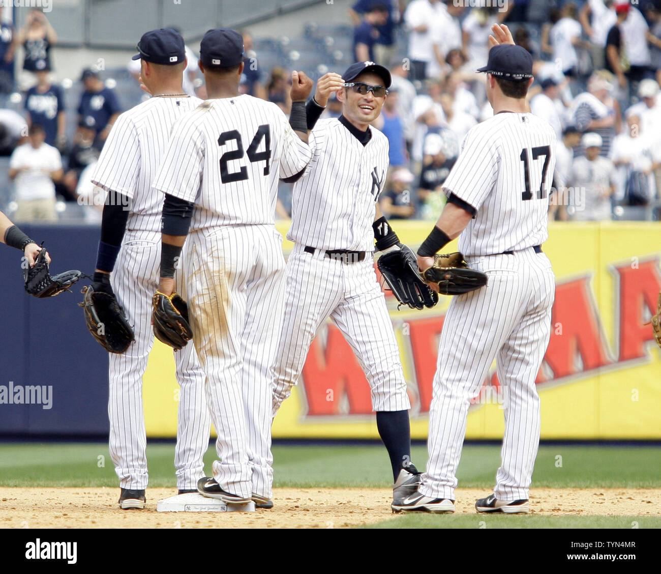 New York Yankees Mark Teixeira, Ichiro Suzuki, Robinson Cano and Derek  Jeter react after the game against the Boston Red Sox at Yankee Stadium in  New York City on July 27, 2012.