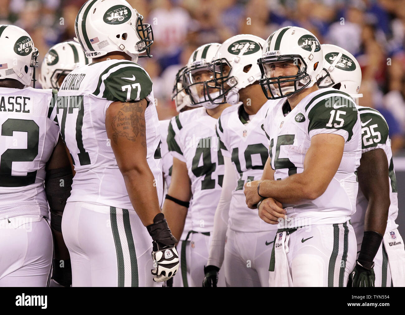 New York Jets Tim Tebow stands in the huddle in the third quarter against  the New York Giants in a pre season NFL game at MetLife Stadium in East  Rutherford, New Jersey