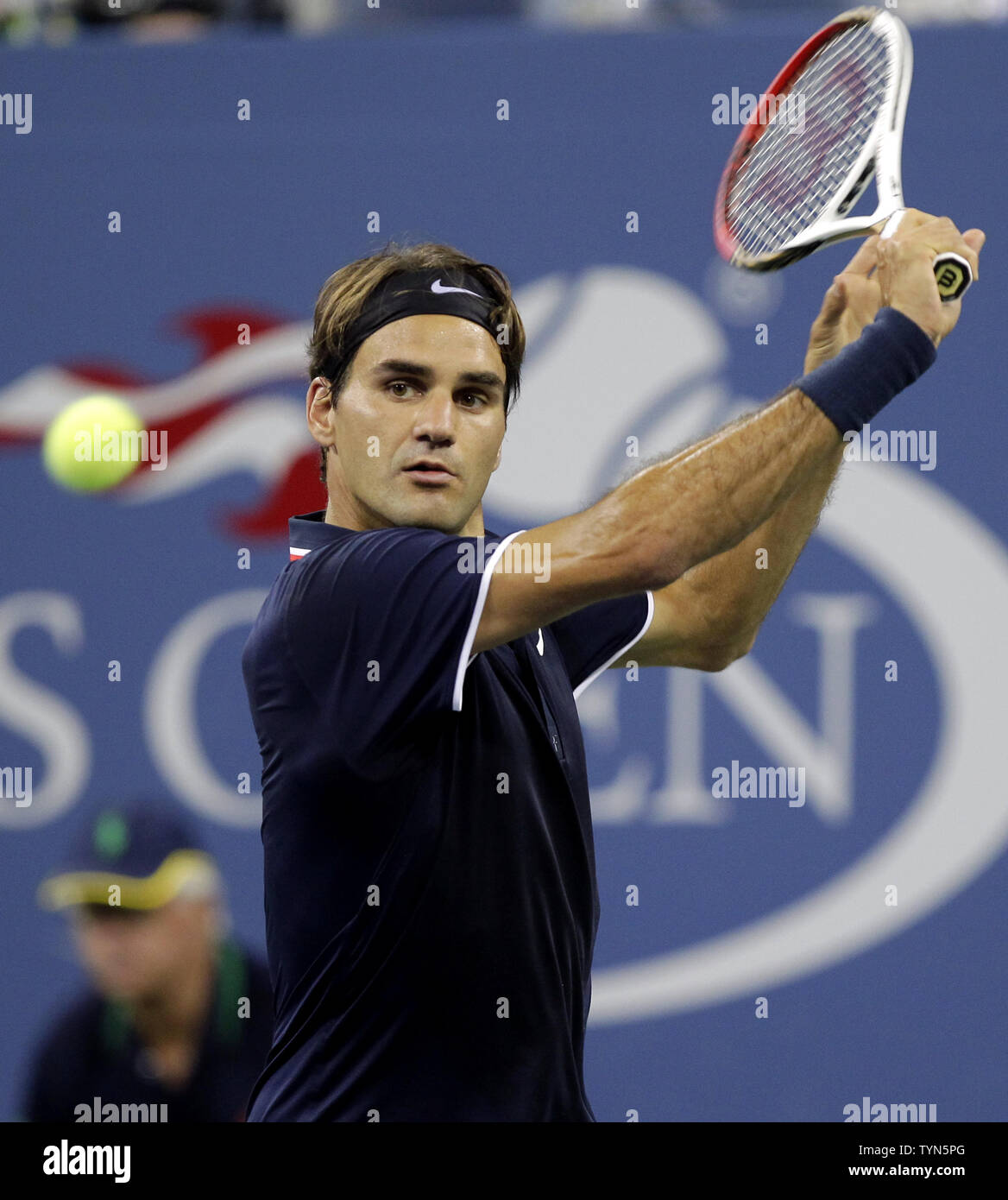 Roger Federer of Switzerland hits a backhand to Bjorn Phau of Germany in their second round match at the 2012 U.S. Open Tennis Championships in Arthur Ashe Stadium at the Billie Jean King National Tennis Center in New York City on August 30, 2012.      UPI/John Angelillo Stock Photo