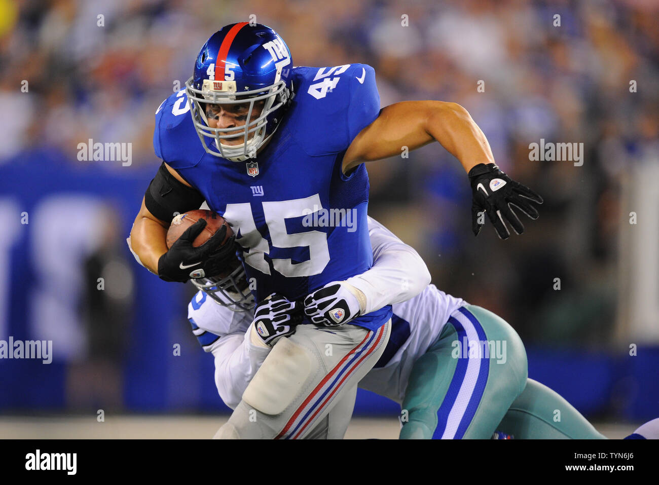 New York Giants running back Henry Hynoski (45) carries the ball against  the Dallas Cowboys in the third quarter in week 1 of the NFL season at  MetLife Stadium in East Rutherford,