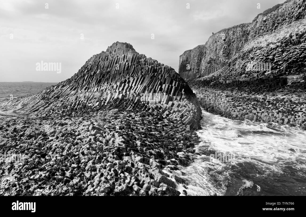 Contorted basalt columns on the Isle of Staffa near landing jetty Fingal's Cave, one of the Inner Hebrides group of islands off Scotland's west coast. Stock Photo