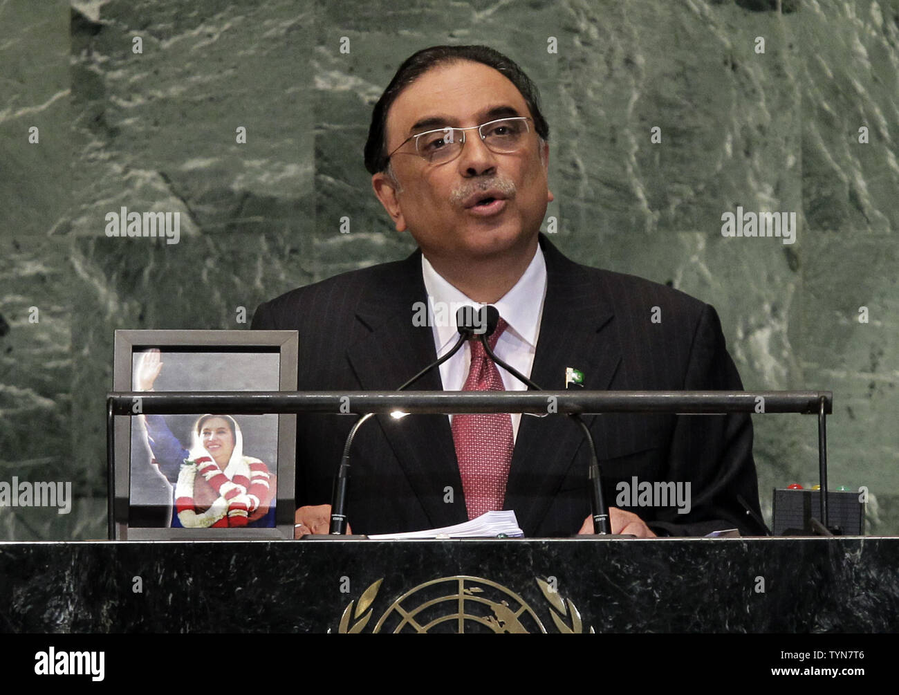 His Excellency Asif Ali Zardari, President of the Islamic Republic of Pakistan addresses the United Nations with a photo of the late Prime Minister Benazir Bhutto to his right at the 67th United Nations General Assembly in the UN building in New York City on September 25, 2012. Bhutto, who was assassinated in 2007.    UPI/John Angelillo Stock Photo