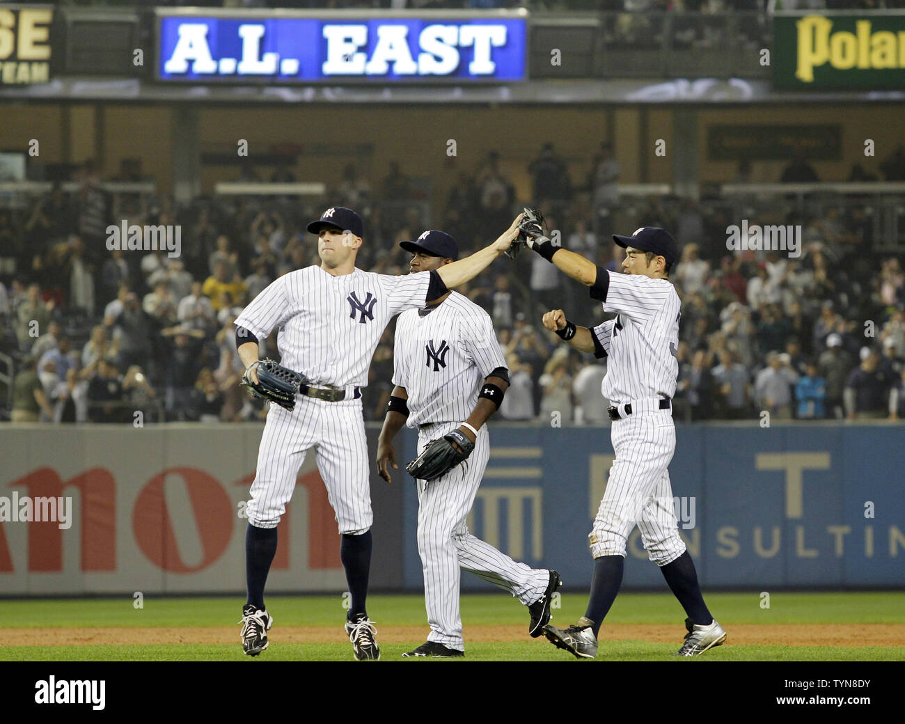 American League's Robinson Cano (L) jokes around with his