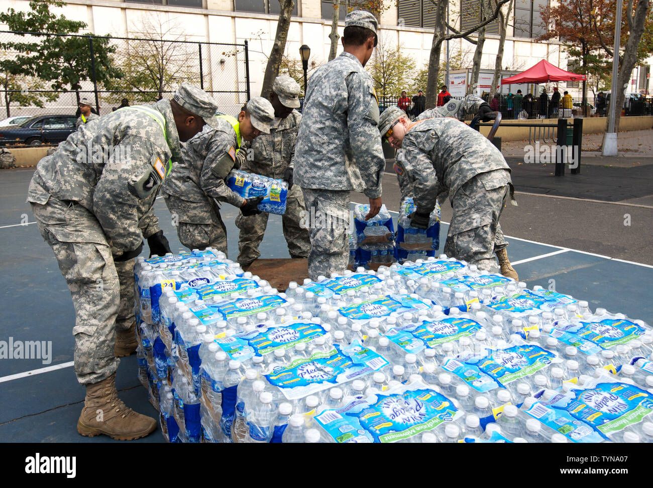 Members of the National Guard stack bottled water which will be distributed to residents who have been without power in the neighborhood of Chelsea due to Hurricane Sandy on November 2, 2012 in New York City. Hundreds of thousands throughout the eastern seaboard have been without power after the superstorm brought on record storm surges and intense winds.     UPI /Monika Graff Stock Photo