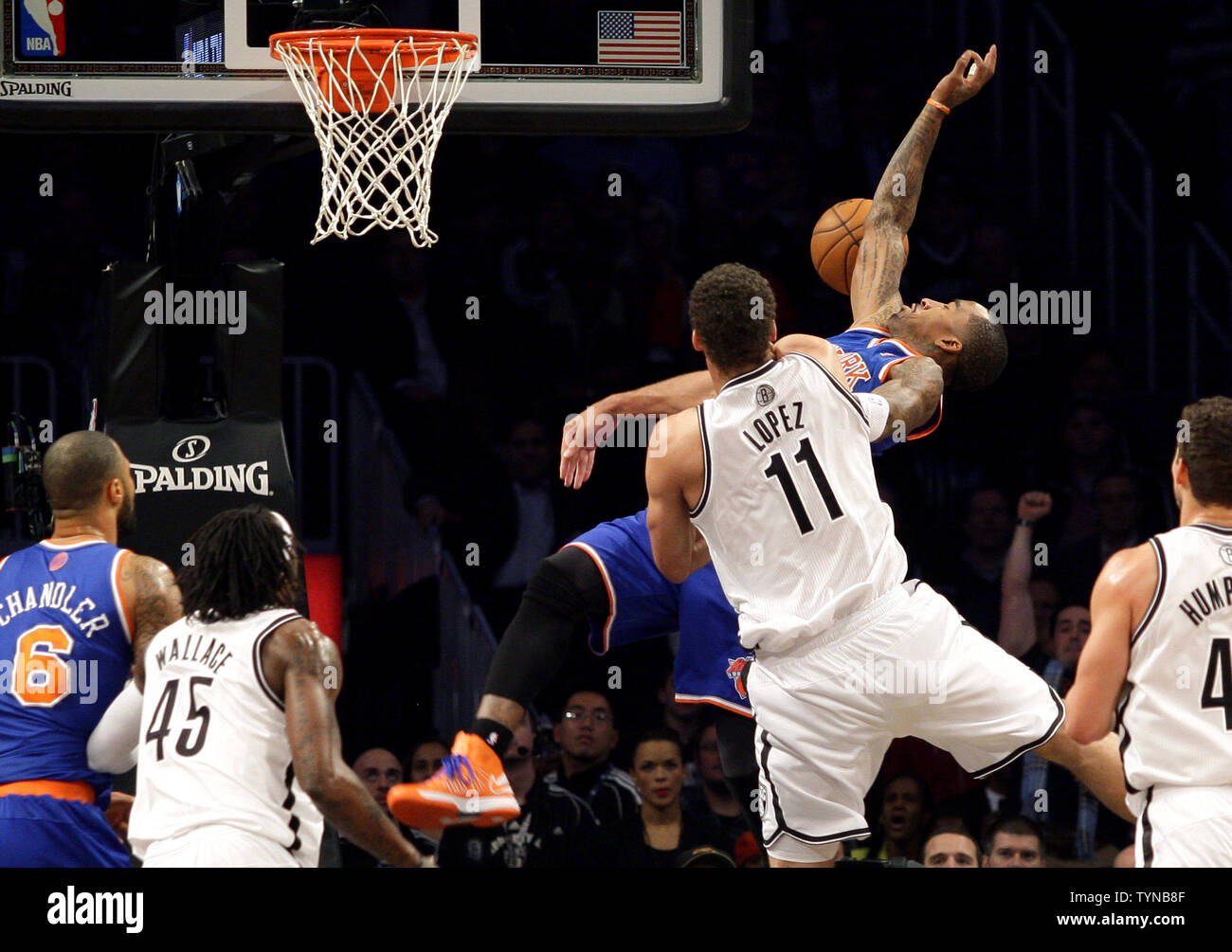 Brooklyn Nets Brook Lopez fouls New York Knicks J.R. Smith in the second quarter at the Barclays Center in New York City on November 26, 2012.   UPI/John Angelillo Stock Photo