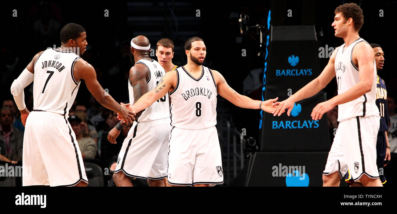 Brooklyn Nets guard Joe Johnson (7) Brooklyn Nets guard Deron Williams (8) and Brooklyn Nets center Brook Lopez (11) react in the fourth quarter against Indiana Pacers at the Barclays Center in New York City on January 13, 2013.  Nets defeat Pacers 97-86.     UPI/Nicole Sweet Stock Photo
