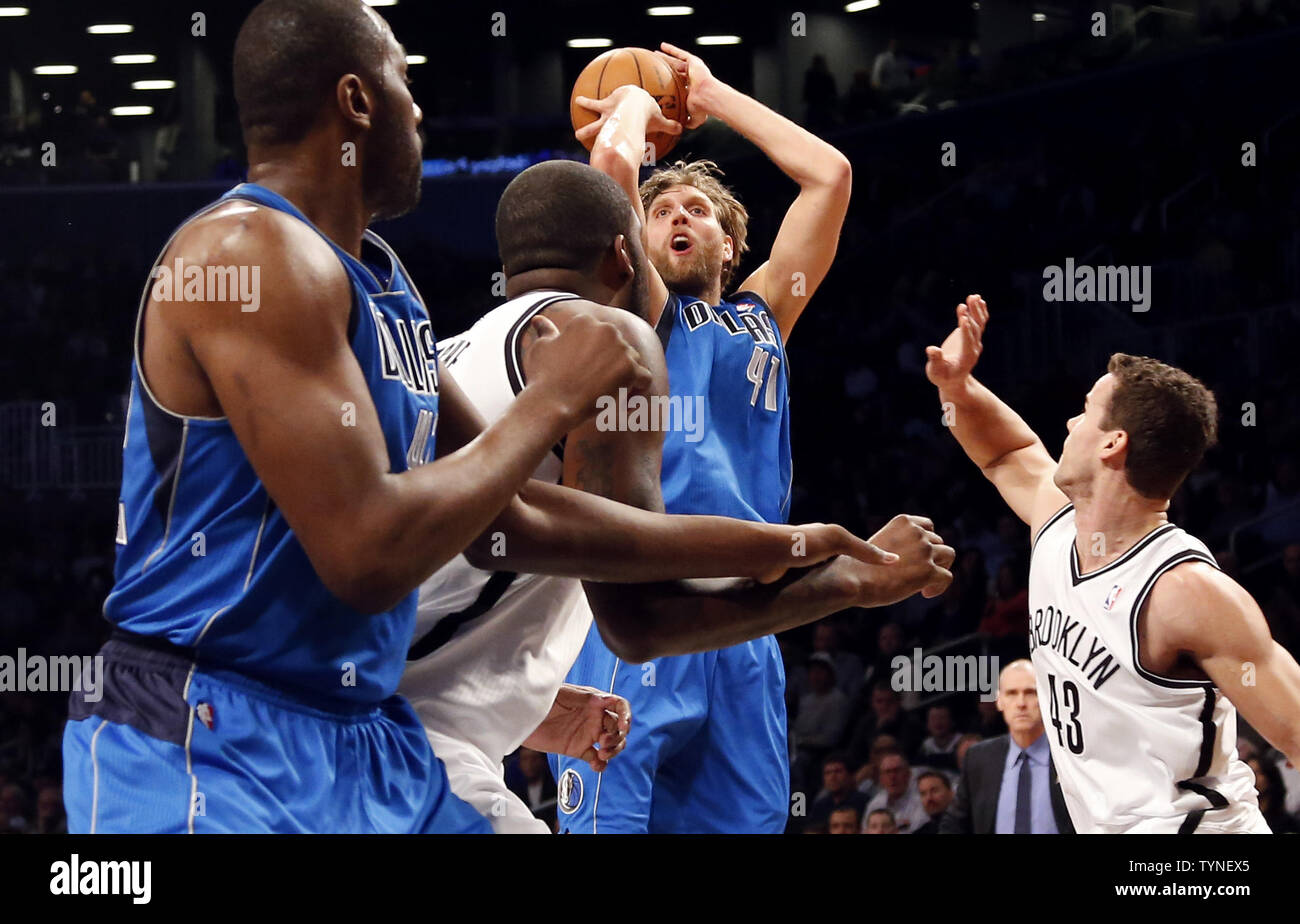 Brooklyn Nets Kris Humphries watches Dallas Mavericks Dirk Nowitzki shoot a jump shot in the first half at Barclays Center in New York City on March 1, 2013.     UPI/John Angelillo Stock Photo