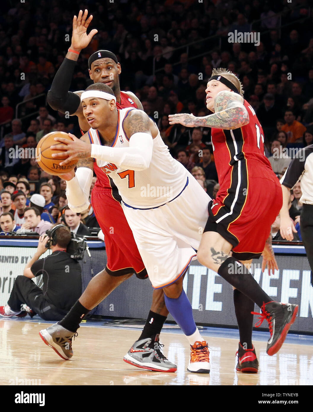New York Knicks Carmelo Anthony drives between Miami Heat LeBron James and Chris  Anderson in the second half at Madison Square Garden in New York City on  March 3, 2013. The Heat