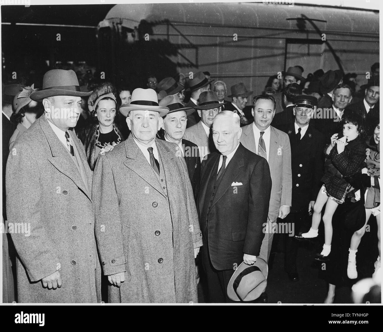Vice President-elect Alben W. Barkley standing with several unidentified people. Barkley had just returned to Washington, DC after his victory in the 1948 election. Stock Photo