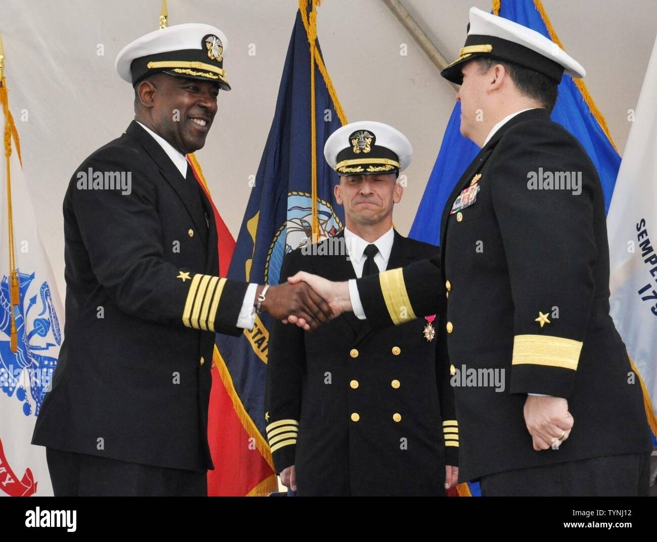 https://c8.alamy.com/comp/TYNJ12/dahlgren-va-nov-18-2016-capt-godfrey-weekes-left-incoming-commanding-officer-of-the-naval-surface-warfare-center-dahlgren-division-nswcdd-greets-rear-adm-tom-druggan-right-commander-of-the-naval-surface-warfare-center-and-capt-brian-durant-center-outgoing-commanding-officer-of-nswcdd-during-a-change-of-command-ceremony-at-naval-support-facility-dahlgren-nswcdd-is-a-premier-research-and-development-center-that-serves-as-a-specialty-site-for-weapon-system-integration-the-commands-unique-ability-to-rapidly-introduce-new-technology-into-complex-warfighting-systems-is-based-TYNJ12.jpg