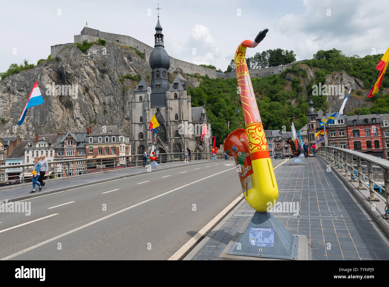 Saxophone statue (Luxembourg) on the Charles de Gaulle bridge in the Belgian city of Dinant Stock Photo