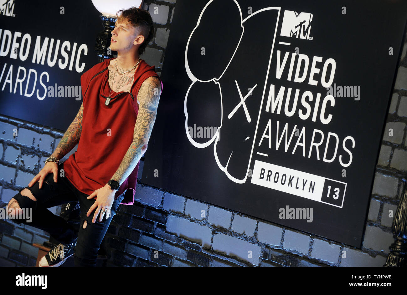 Machine Gun Kelly arrives on the red carpet at the 2013 MTV Video Music ...