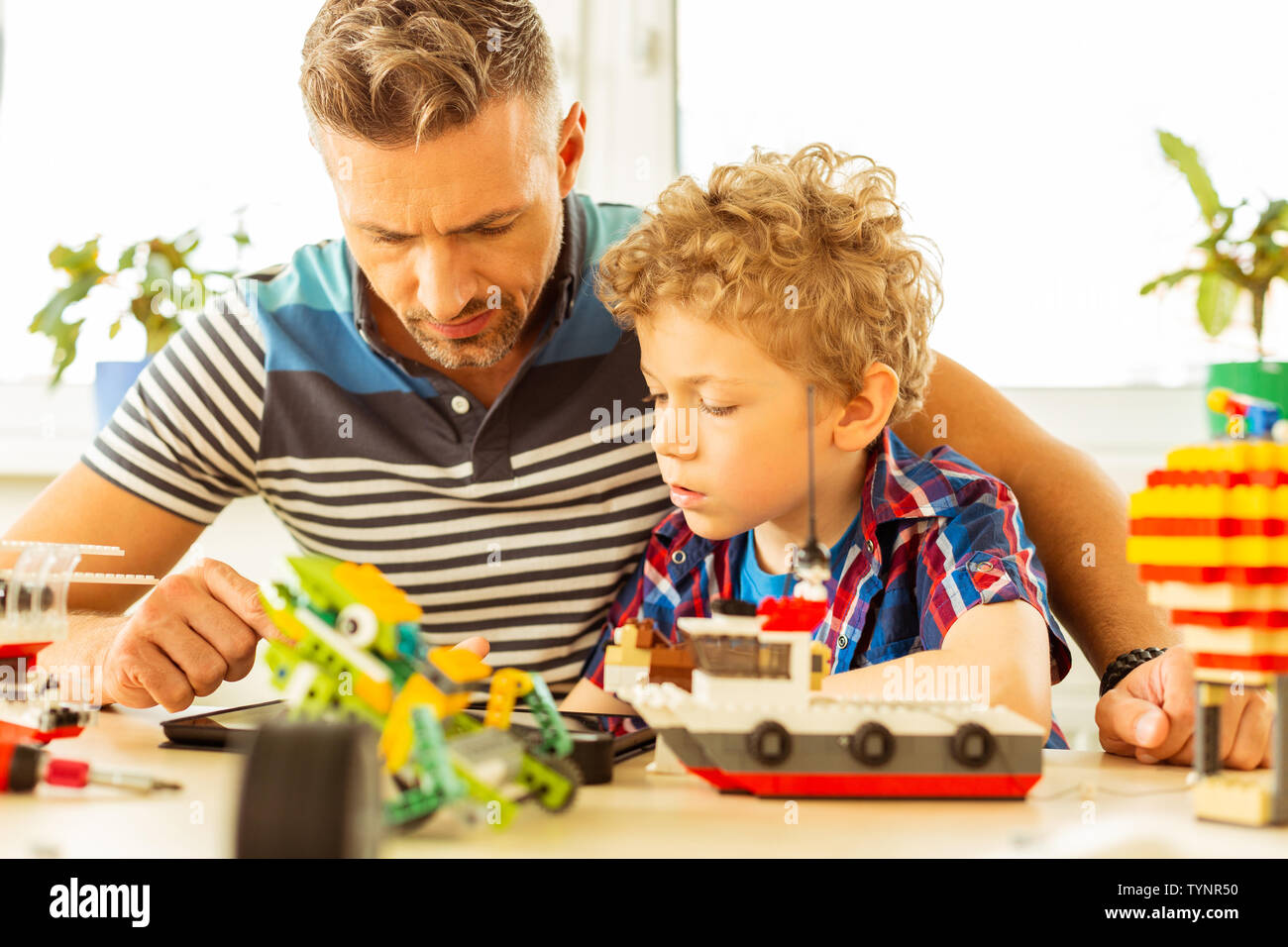 Watching a tutorial hi-res stock photography and images - Alamy