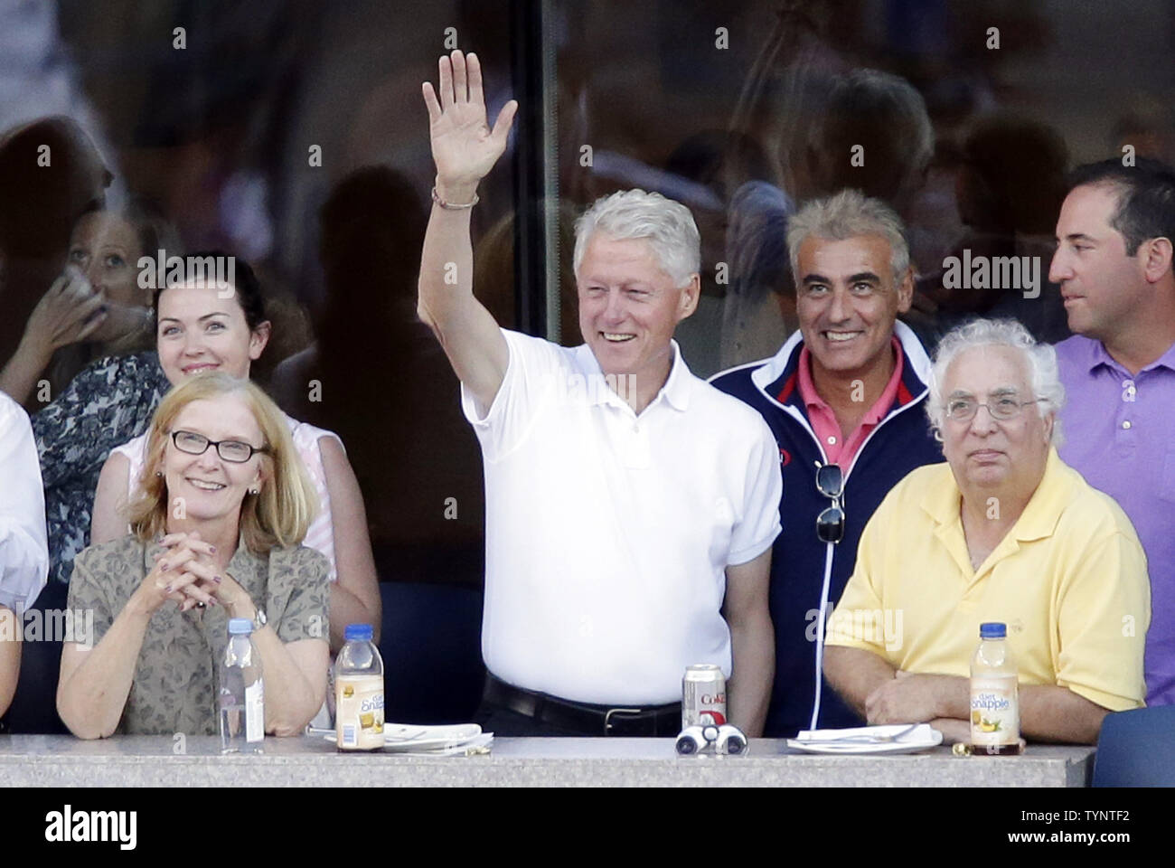 Former US President Bill Clinton watches Serena Williams play Victoria Azarenka of Belarus in the Woman's Final in Arthur Ashe Stadium at the U.S. Open Tennis Championships at the USTA Billie Jean King National Tennis Center in New York City on September 8, 2013. Williams wins her second consecutive U.S. Open Championship by defeating Azarenka 7-5, 6-7, 6-1.   UPI/John Angelillo Stock Photo