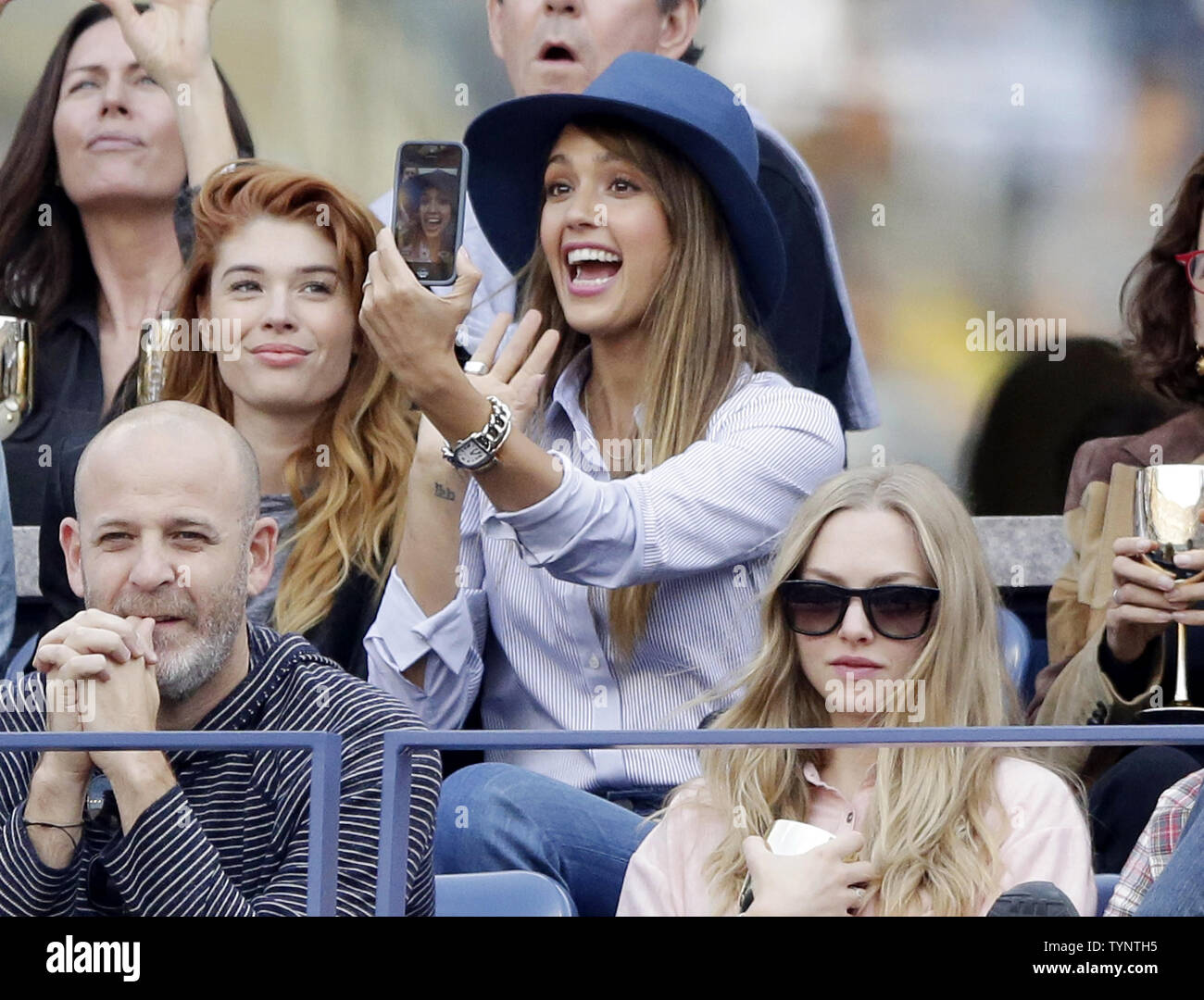 Jessica Alba watches Novak Djokovic of Serbia play Rafael Nadal of Spain in the Mens Final in Arthur Ashe Stadium at the U.S. Open Tennis Championships at the USTA Billie Jean King National Tennis Center in New York City on September 9, 2013.   UPI/John Angelillo Stock Photo