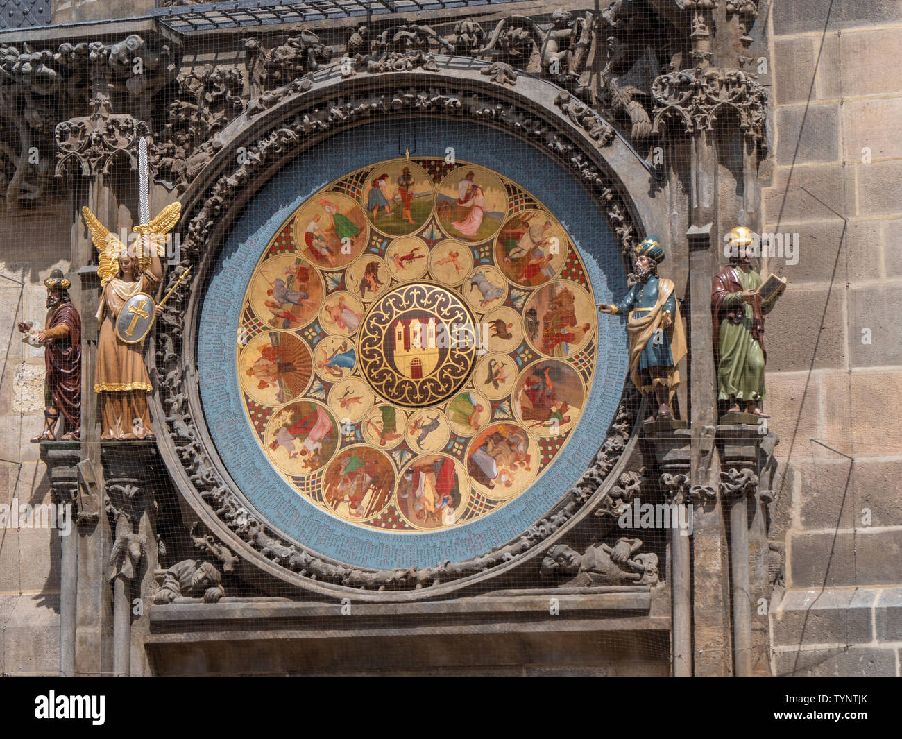 Prague, Czech Republic - June 9 2019: Calendar Board of the Astronomical Clock Prazske Orloj and Statues of the philosopher, angerl astronomer and chr Stock Photo