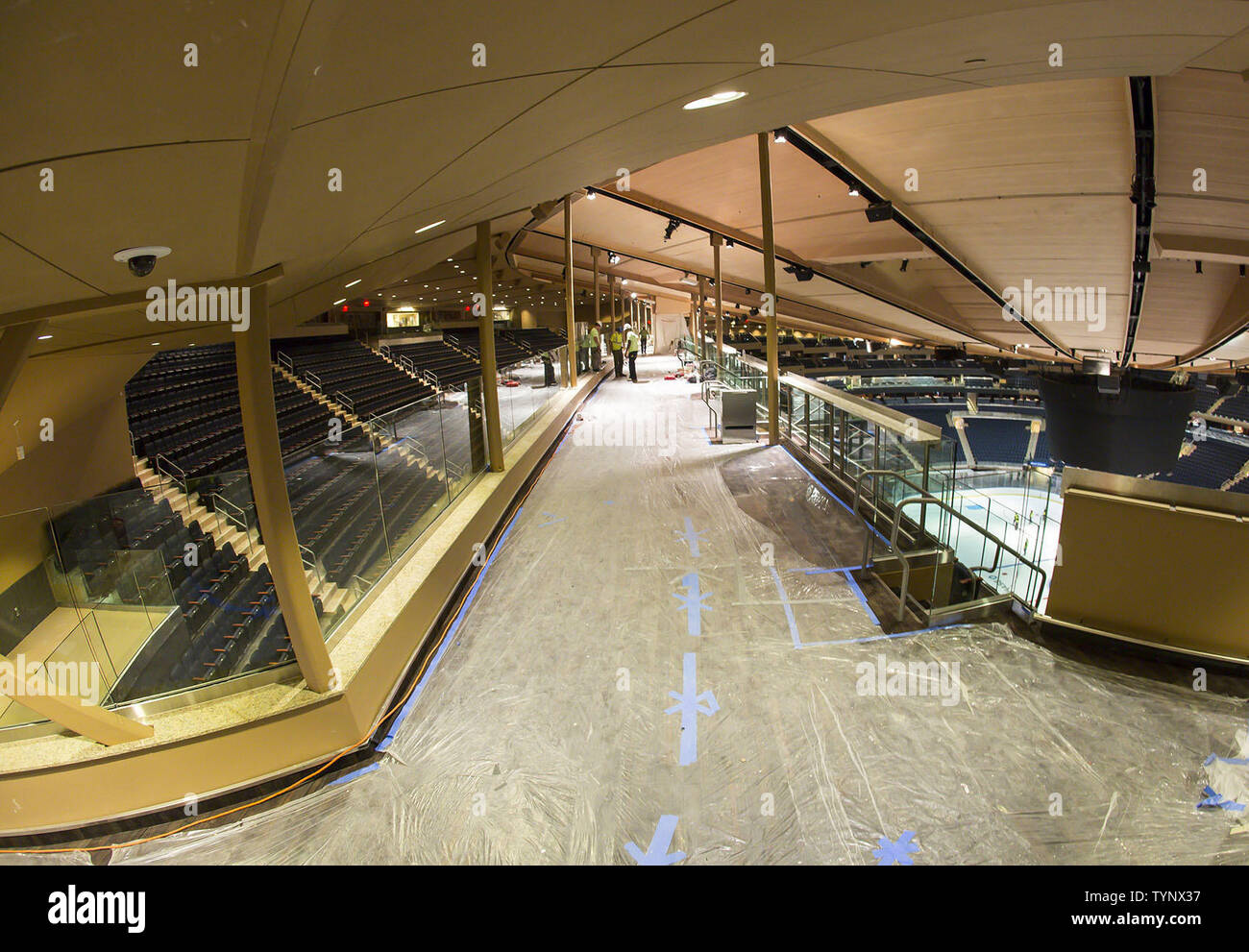 The Chase Bridges are fully installed at Madison Square Garden for the reopening of the arena after 3 years of on and off construction in New York City on October 16, 2013.  These photos show two revolutionary glass-walled seating bridges attached to the roof that hold 430 seats, each going for $110 to $210. The Garden has been shutting down for four to five months every year for the past three years to finish the billion-dollar renovation, which also includes wider concourses, mores suites and comfortable new balcony seating.     UPI/Rebecca Taylor/MSG Photos Stock Photo