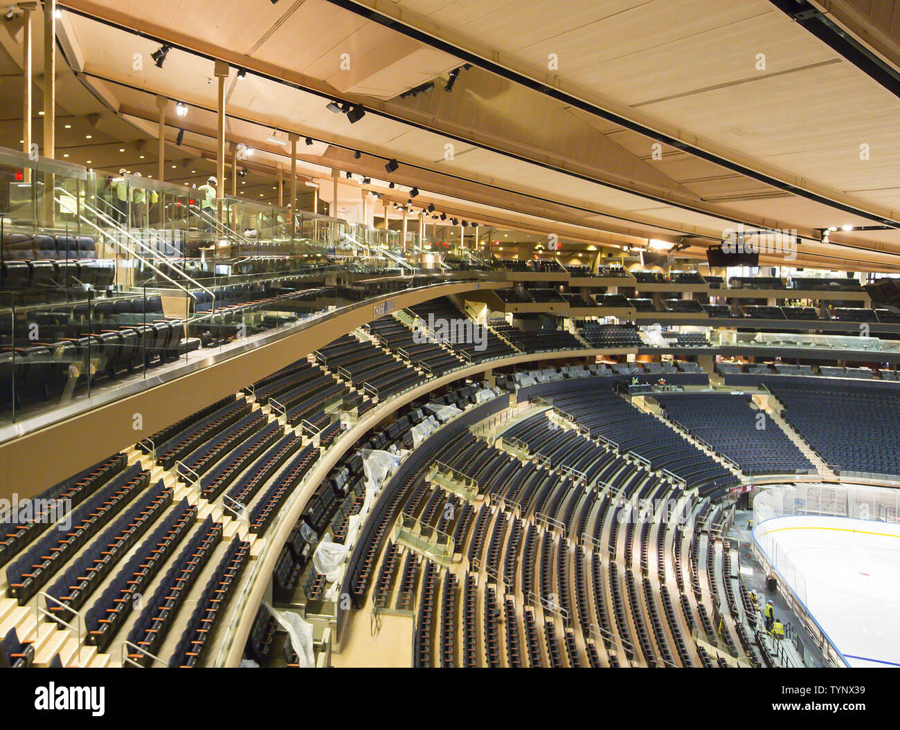 The Chase Bridges are fully installed at Madison Square Garden for the reopening of the arena after 3 years of on and off construction in New York City on October 16, 2013.  These photos show two revolutionary glass-walled seating bridges attached to the roof that hold 430 seats, each going for $110 to $210. The Garden has been shutting down for four to five months every year for the past three years to finish the billion-dollar renovation, which also includes wider concourses, mores suites and comfortable new balcony seating.     UPI/Rebecca Taylor/MSG Photos Stock Photo