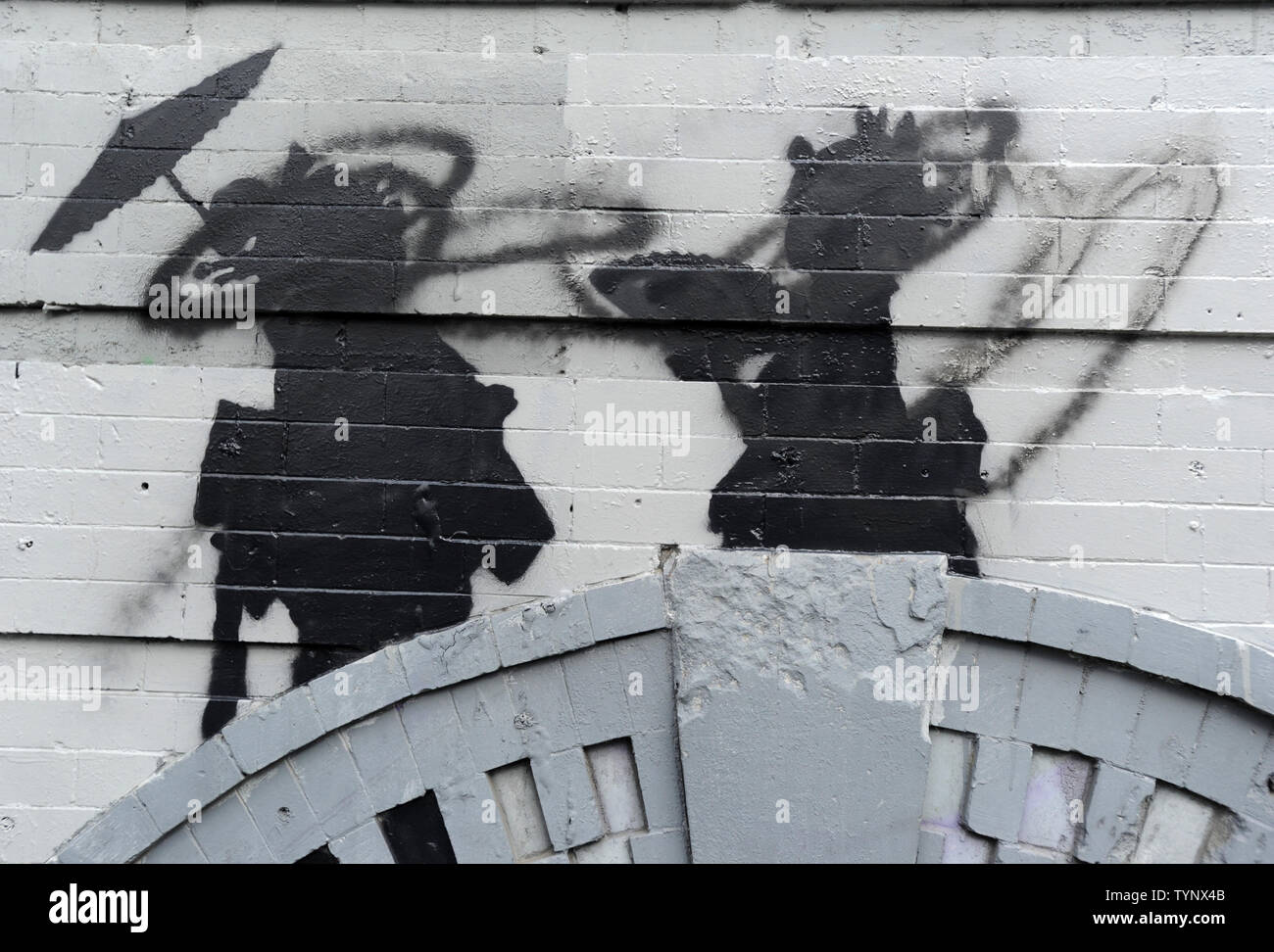 An art installation created by British street artist Banksy is seen in Williamsburg in New York City on October 17, 2013. Banksy is a pseudonymous England-based graffiti artist, political activist, film director, and painter. His satirical street art and subversive epigrams combine dark humor with graffiti done in a distinctive stenciling technique.    UPI/Dennis Van Tine Stock Photo