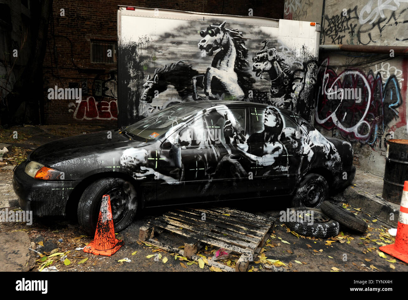 An art work created by British street artist Banksy stands outside in the East Village of Manhattan in New York City in October of 2013. Banksy is a pseudonymous England-based graffiti artist, political activist, film director, and painter. His satirical street art and subversive epigrams combine dark humor with graffiti done in a distinctive stenciling technique.    UPI/Dennis Van Tine Stock Photo