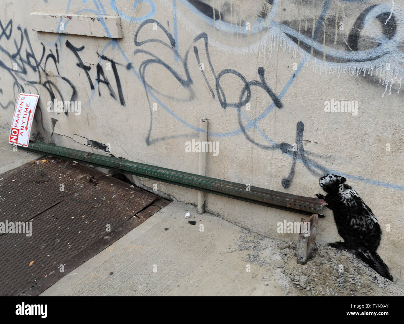 An art work created by British street artist Banksy is seen in New York City on October 10, 2013. Banksy is a pseudonymous England-based graffiti artist, political activist, film director, and painter. His satirical street art and subversive epigrams combine dark humor with graffiti done in a distinctive stenciling technique.    UPI/Dennis Van Tine Stock Photo