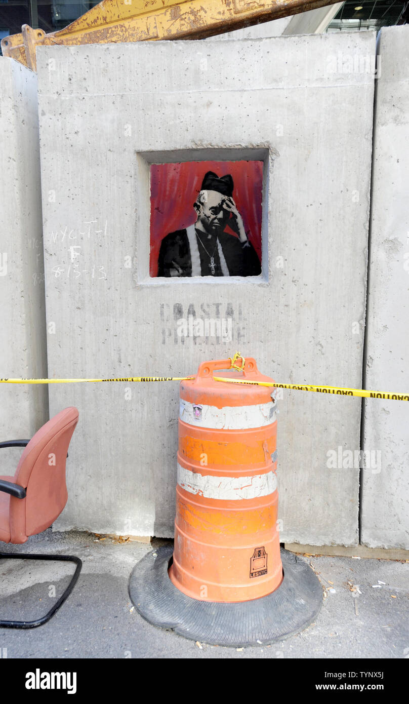 The 'Concrete Confessional' art installation created by British street artist Banksy is seen on the Lower East Side in New York City on October 14, 2013. Banksy is a pseudonymous England-based graffiti artist, political activist, film director, and painter. His satirical street art and subversive epigrams combine dark humor with graffiti done in a distinctive stenciling technique.    UPI/Dennis Van Tine Stock Photo