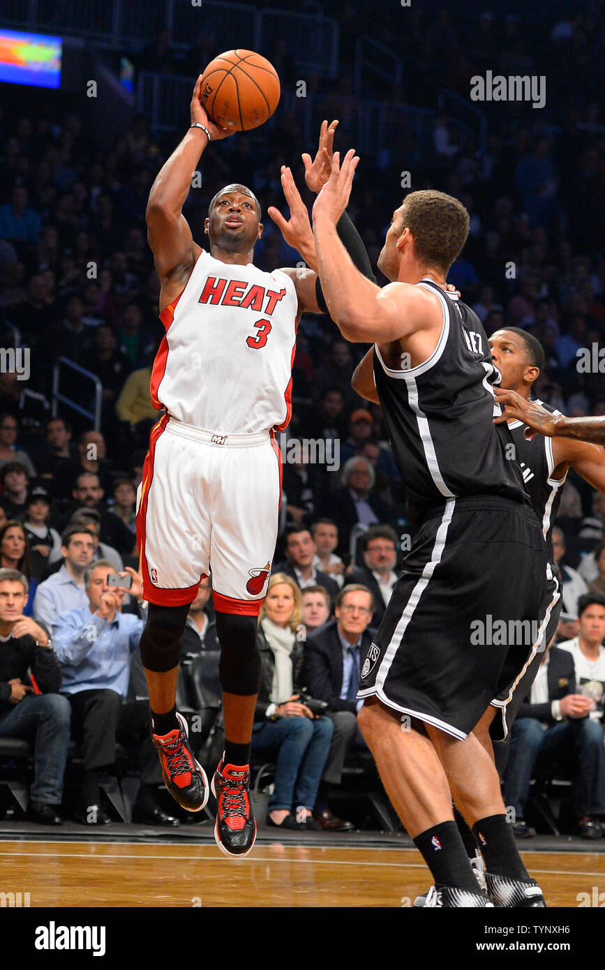 Miami Heat shooting guard Dwyane Wade (3) shoots over Brooklyn Nets center Brook Lopez (11) during the first quarter at Barclays Center in New York City on November 1, 2013.   UPI/Rich Kane Stock Photo
