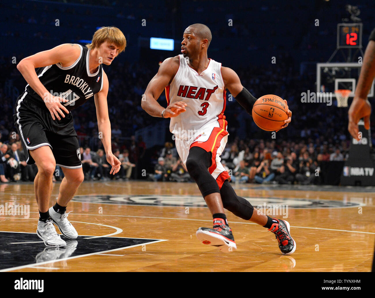 Miami Heat shooting guard Dwyane Wade (3) drives in against Brooklyn Nets small forward Andrei Kirilenko (47) in the second quarter at Barclays Center in New York City on November 1, 2013.   UPI/Rich Kane Stock Photo