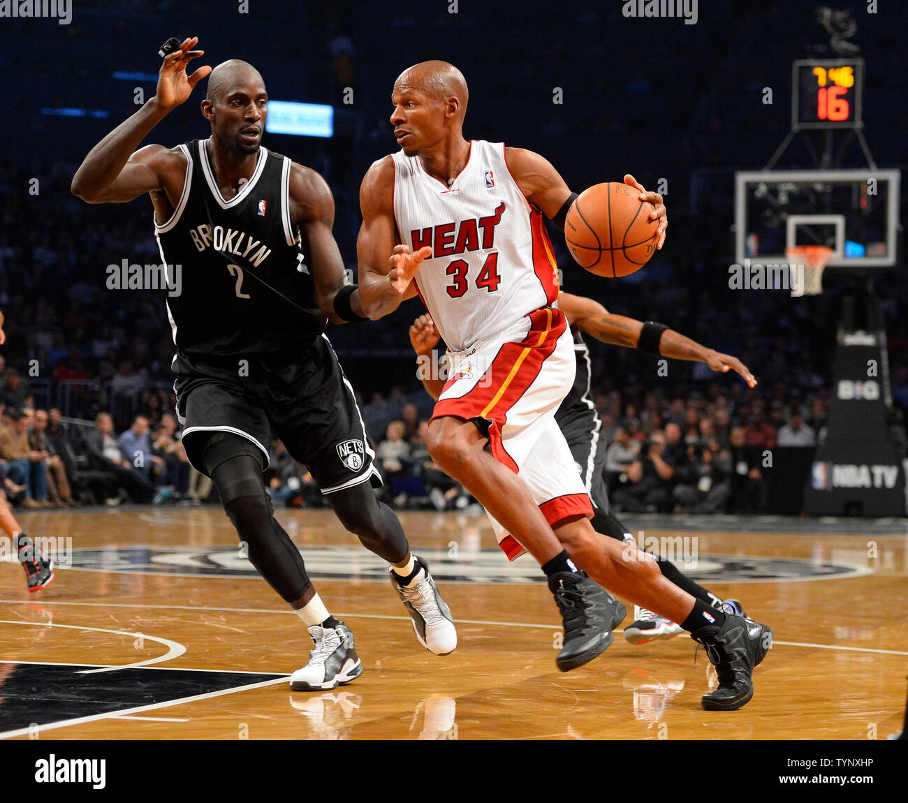Miami Heat shooting guard Ray Allen (34) drives in against Brooklyn Nets power forward Kevin Garnett (2) during the second quarter at Barclays Center in New York City on November 1, 2013.   UPI/Rich Kane Stock Photo