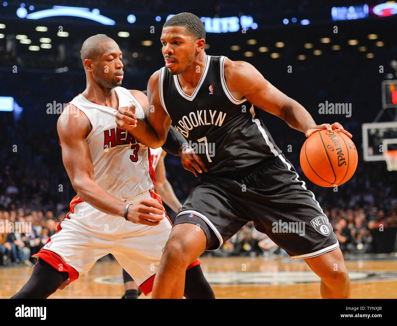 Brooklyn Nets shooting guard Joe Johnson (7) drives in against Miami Heat shooting guard Dwyane Wade (3) in the fourth quarter at Barclays Center in New York City on November 1, 2013.   UPI/Rich Kane Stock Photo