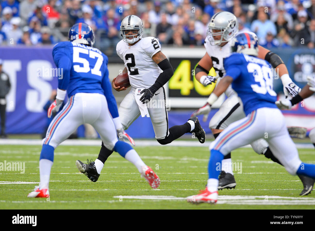 Oakland Raiders quarterback Terrelle Pryor (2) runs the ball against New York Giants outside linebacker Jacquian Williams (57) in the first quarter in week 10 of the NFL season at MetLife Stadium in East Rutherford, New Jersey on November 10,  2013.     UPI/Rich Kane Stock Photo