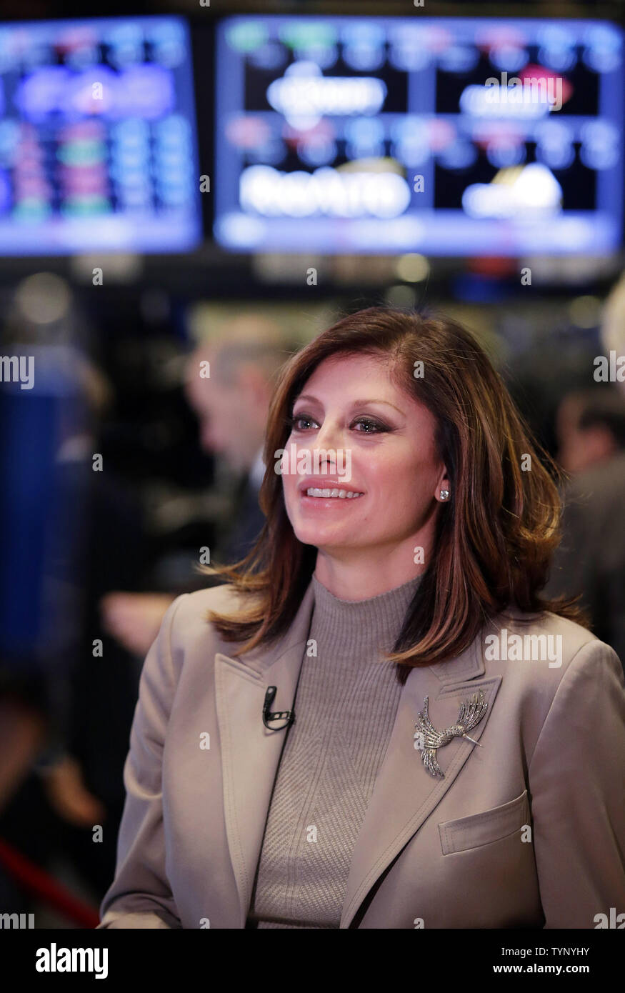 Maria Bartiromo does her CNBC broadcast from the floor of the NYSE before the closing bell on Wall Street In New York City on November 19, 2013. Maria Bartiromo, the financial journalist known as the 'Money Honey,' is leaving CNBC after 2 decades and is expected to join up with Fox.   UPI/John Angelillo Stock Photo