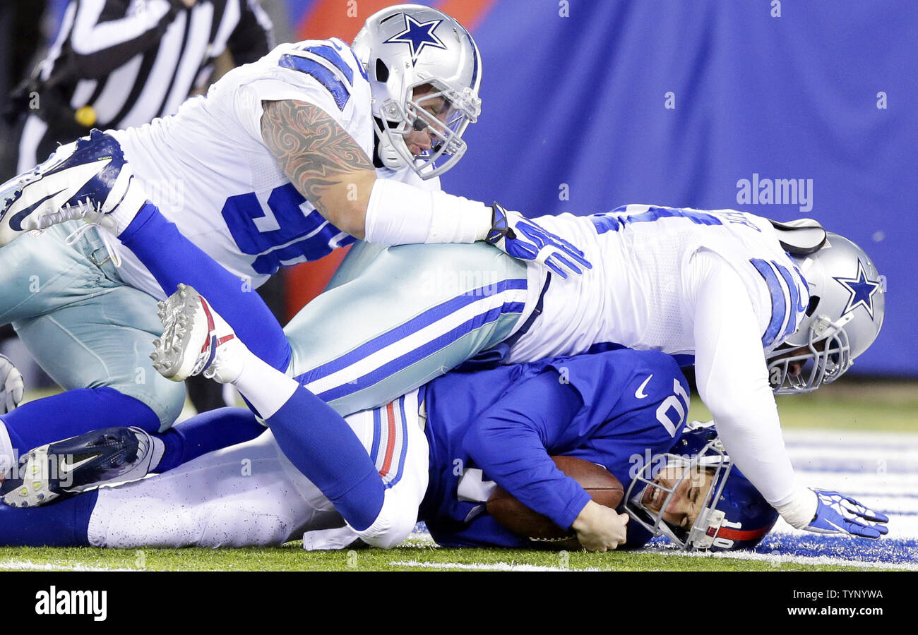 Dallas Cowboys Jason Hatcher sacks New York Giants Eli Manning for an 8 ...