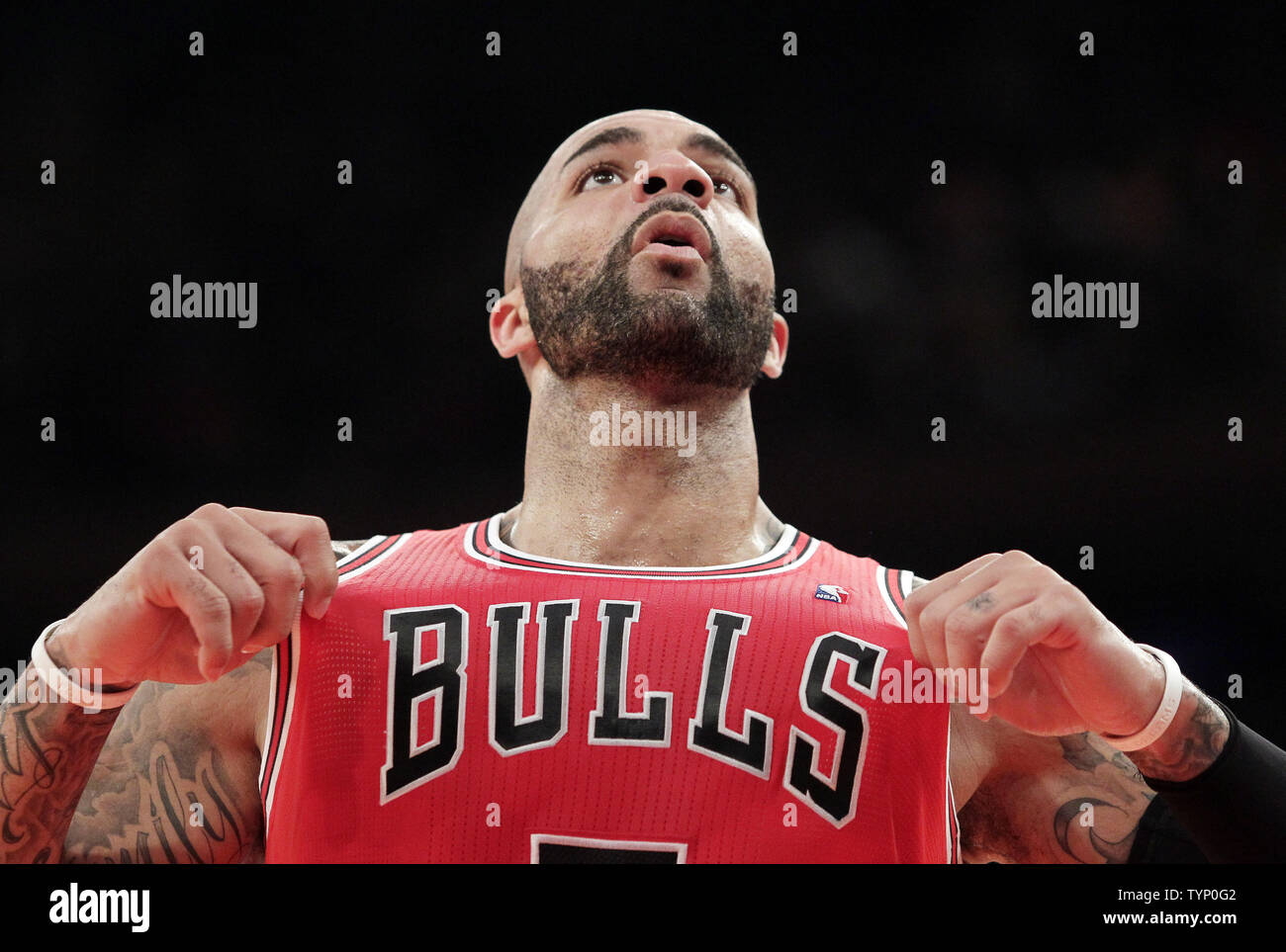Chicago Bulls Carlos Boozer grabs his jersey after a whistle in the first  half against the New York Knicks at Madison Square Garden in New York City  on December 11, 2013. UPI/John, image size:1300x963