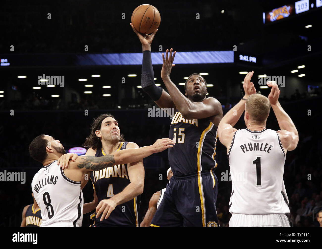 Indiana Pacers Luis Scola Brooklyn Nets Deron Williams And Mason Plumlee Watch Roy Hibbert Take A Shot In The Second Half At Barclays Center In New York City On December 23 2013