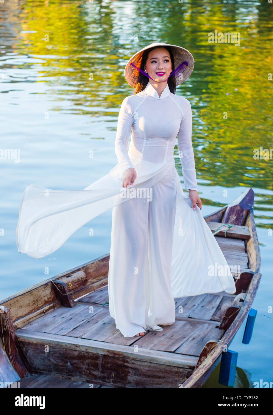 Vietnamese woman wearing Ao Dai dress during the Mid autumn festiaval in  Hoi An Vietnam Stock Photo - Alamy