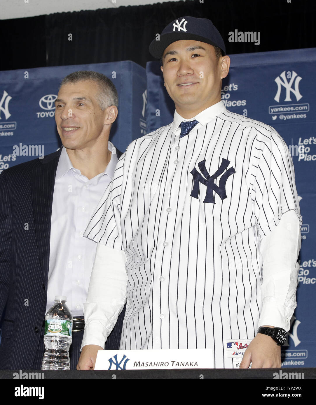 New York Yankees Manager Joe Girardi stands with Masahiro Tanaka