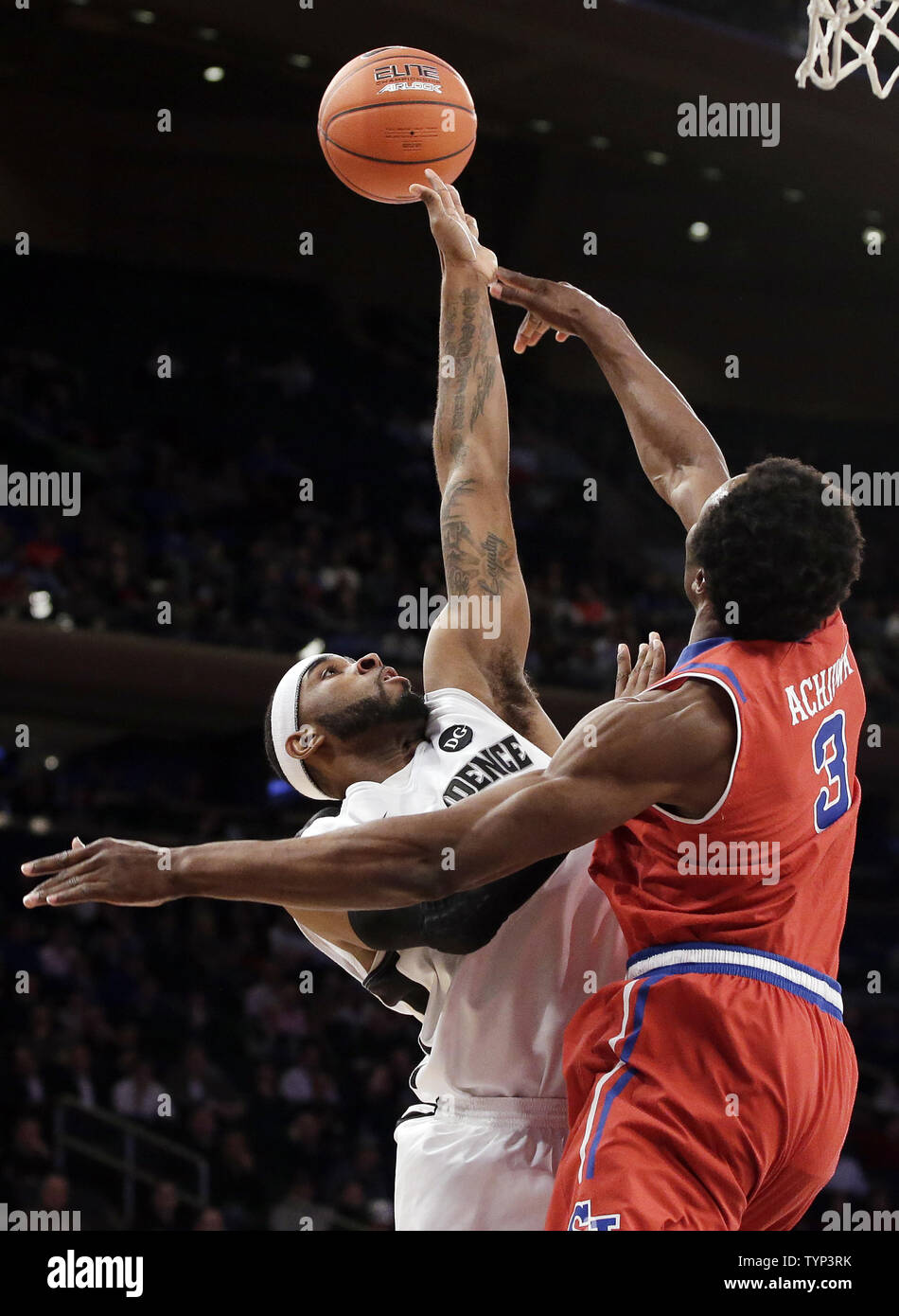 St. John Red Storm God'sgift Achiuwa Blocks A By Providence Friars Ladontae  Henton In The First Half In The Quarterfinals Of The Ncaa Big East  Basketball Championship At Madison Square Garden In