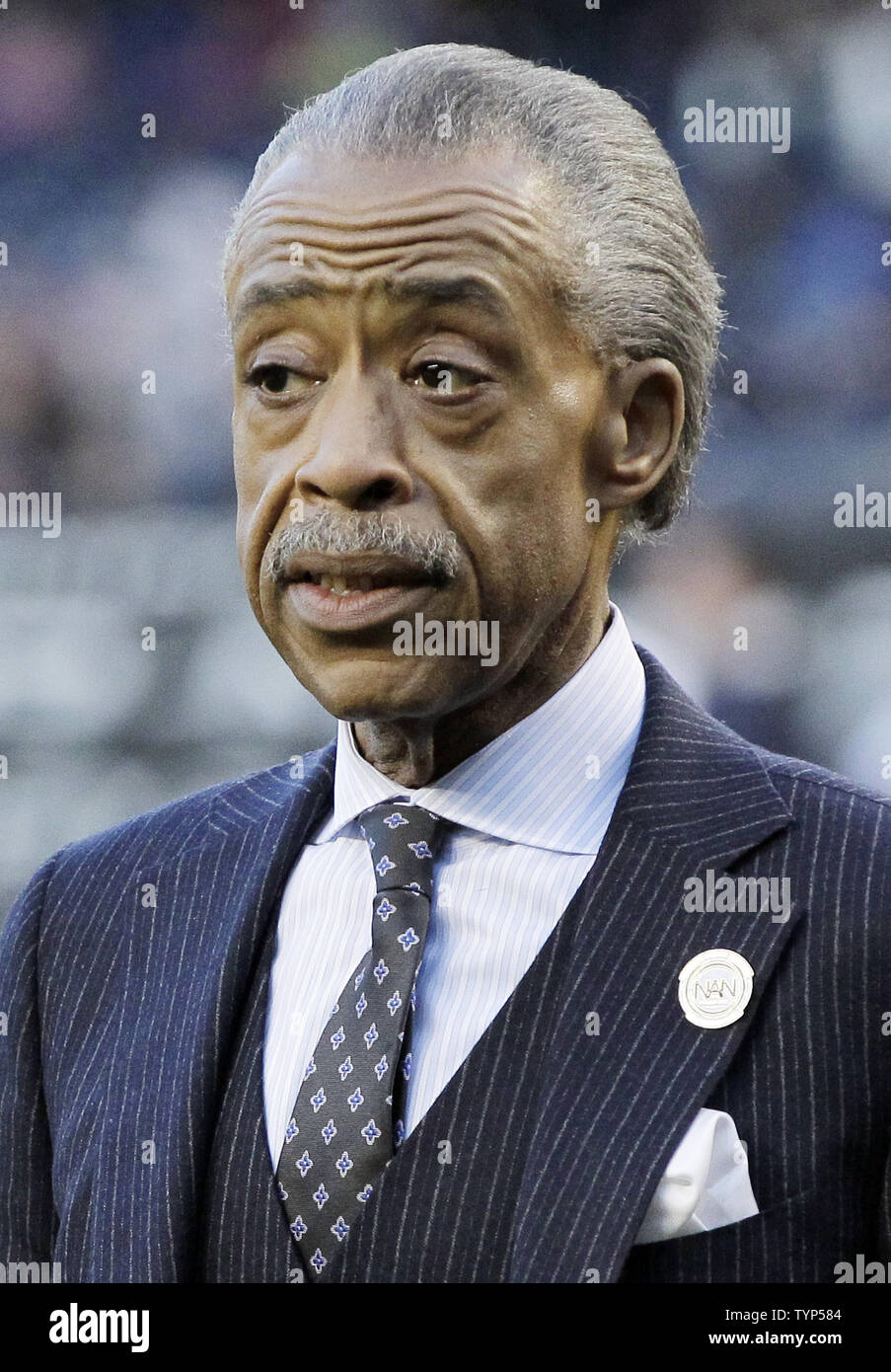 Rev. Al Sharpton stands on the field after a plaque is unveiled in Monument Park honoring the late South African President Nelson Mandela on Jackie Robinson Day in game 2 of a double header against the Chicago Cubs at Yankee Stadium in New York City on April 16, 2014. UPI/John Angelillo Stock Photo