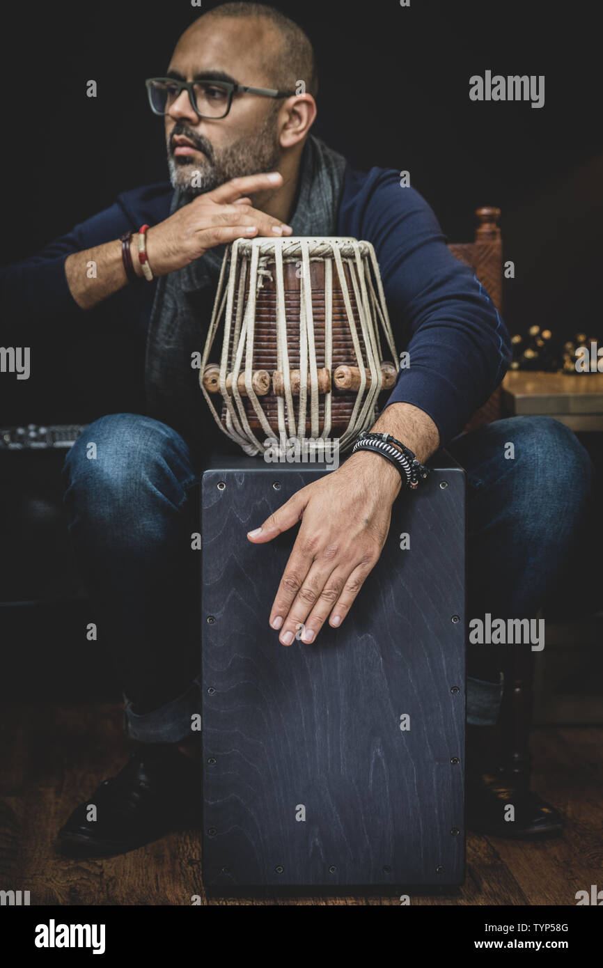 Man's hands playing the percussion instrument Cajon. It is a percussion  instrument of Peruvian origin and is rapidly gaining popularity Stock Photo  - Alamy
