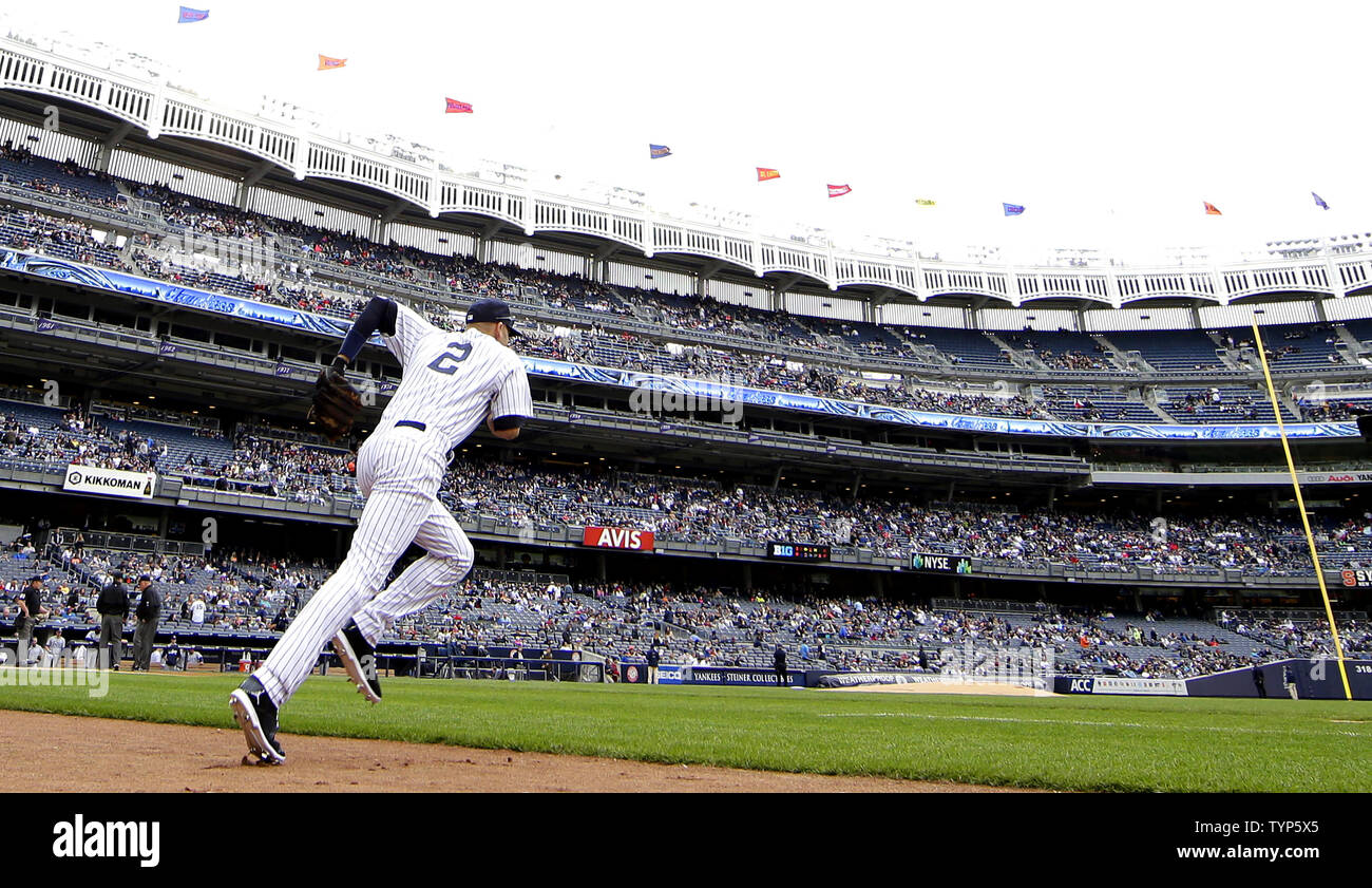 New York Yankees Derek Jeter runs on the filed for the top of the first inning against the Tampa Bay Rays at Yankee Stadium in New York City on May 4, 2014.    UPI/John Angelillo Stock Photo