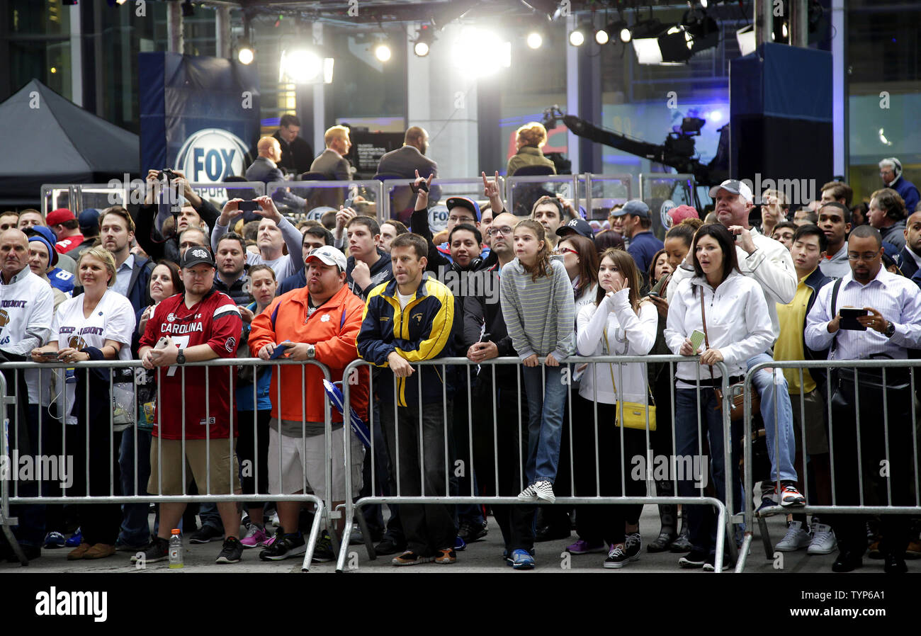 Fans gather on 6th avenue to watch the red carpet arrivals before the 2014  NFL Draft at Radio City Music Hall in New York City on May 8, 2014. The Houston  Texans, image size:1300x898