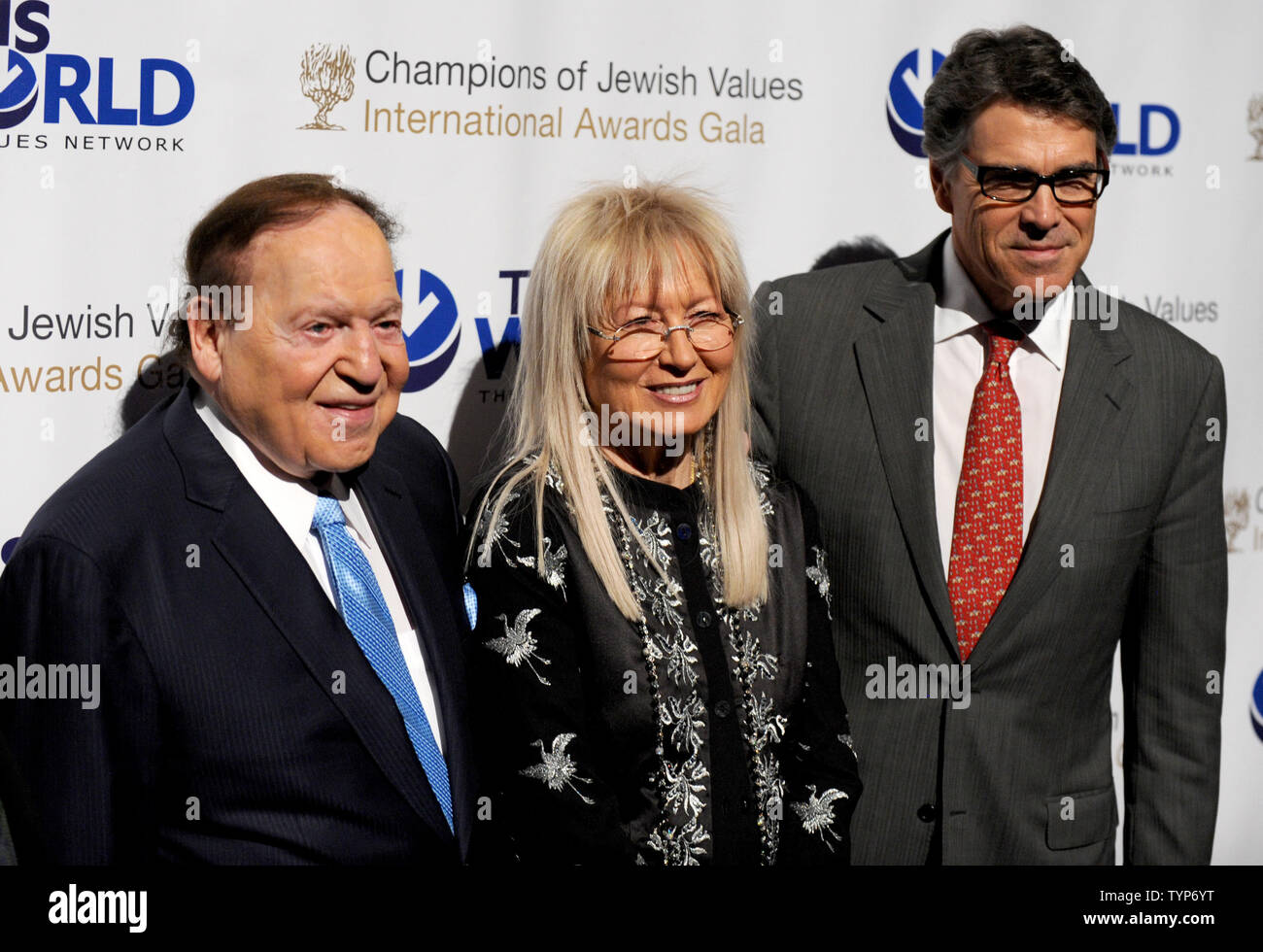 Sheldon Adelson, Dr. Miriam Adelson and Texas Governor Rick Perry arrive at the Second Annual Champions of Jewish Values Awards Gala in New York City on May 18, 2014.      UPI/Dennis Van Tine Stock Photo