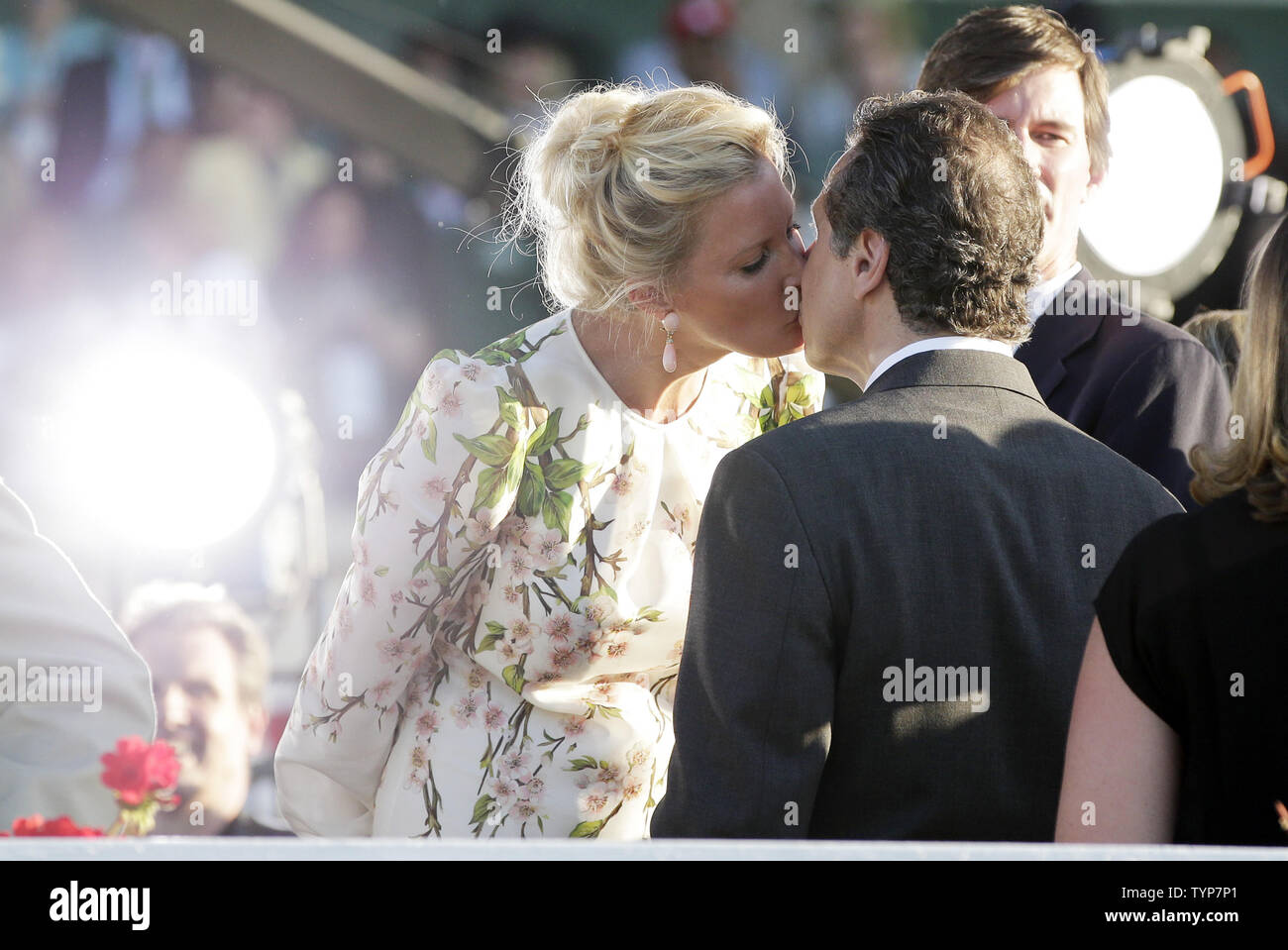 Governor Andrew Cuomo kisses girlfriend Sandra Lee on the TV platform after Tonalist beat Commissioner by a head at the finish and wons the 146th running of the Belmont Stakes in Elmont New York on June 7, 2014. California Chrome came in fourth place and failed to become the first horse in 36 years to win the Triple Crown.      UPI/John Angelillo Stock Photo
