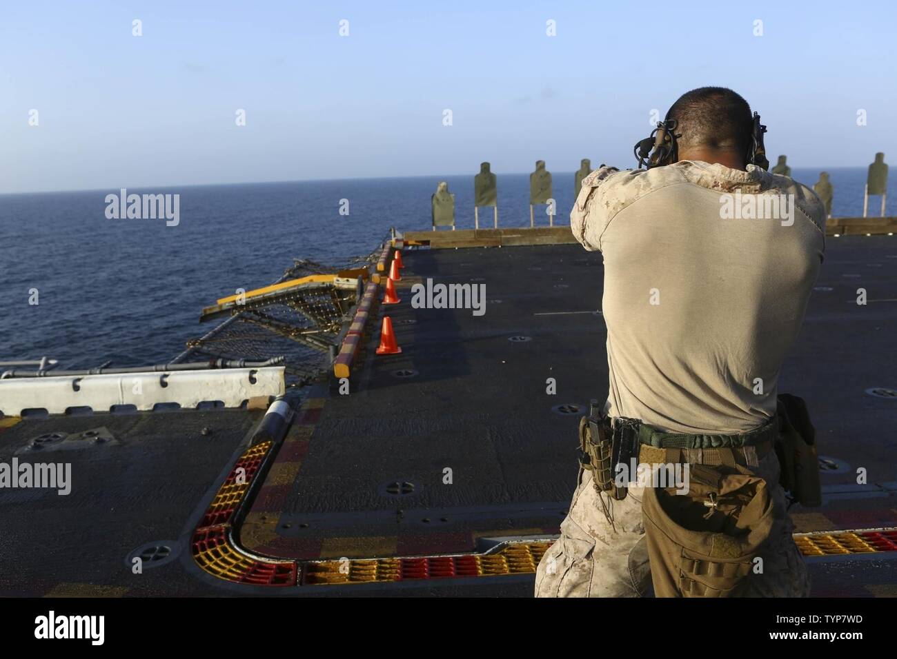 RED SEA (Nov. 20, 2016) Marines with the Maritime Raid Force, 22nd Marine Expeditionary Unit (MEU), participate in a live fire weapons shoot on the flight deck of the amphibious assault ship USS Wasp (LHD 1) on Nov. 20, 2016. The 22nd MEU, deployed with the Wasp Amphibious Ready Group, is conducting naval operations in the U.S. 5th Fleet area of operations in support of U.S. national security interests in Europe and Africa. Stock Photo