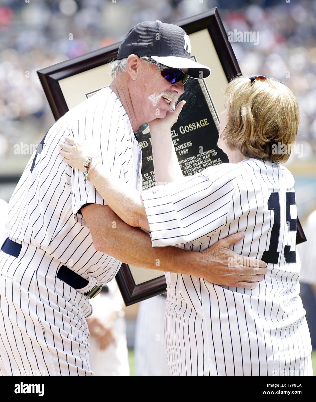 Retired New York Yankee pitcher Goose Gossage hugs Diana Munson after he is honored with a monument to be placed in Monument Park at the 68th Annual Old-Timers' Day before the New York Yankees play the Baltimore Orioles at Yankee Stadium in New York City on on June 22, 2014.   UPI/John Angelillo Stock Photo
