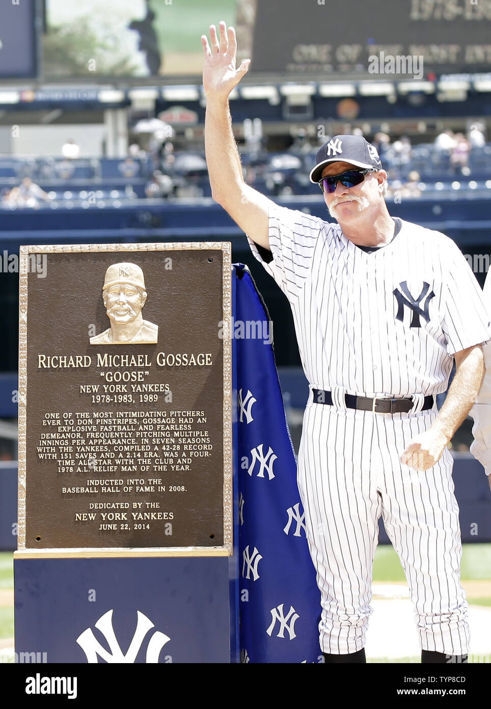 Retired New York Yankee pitcher Goose Gossage waves while standing