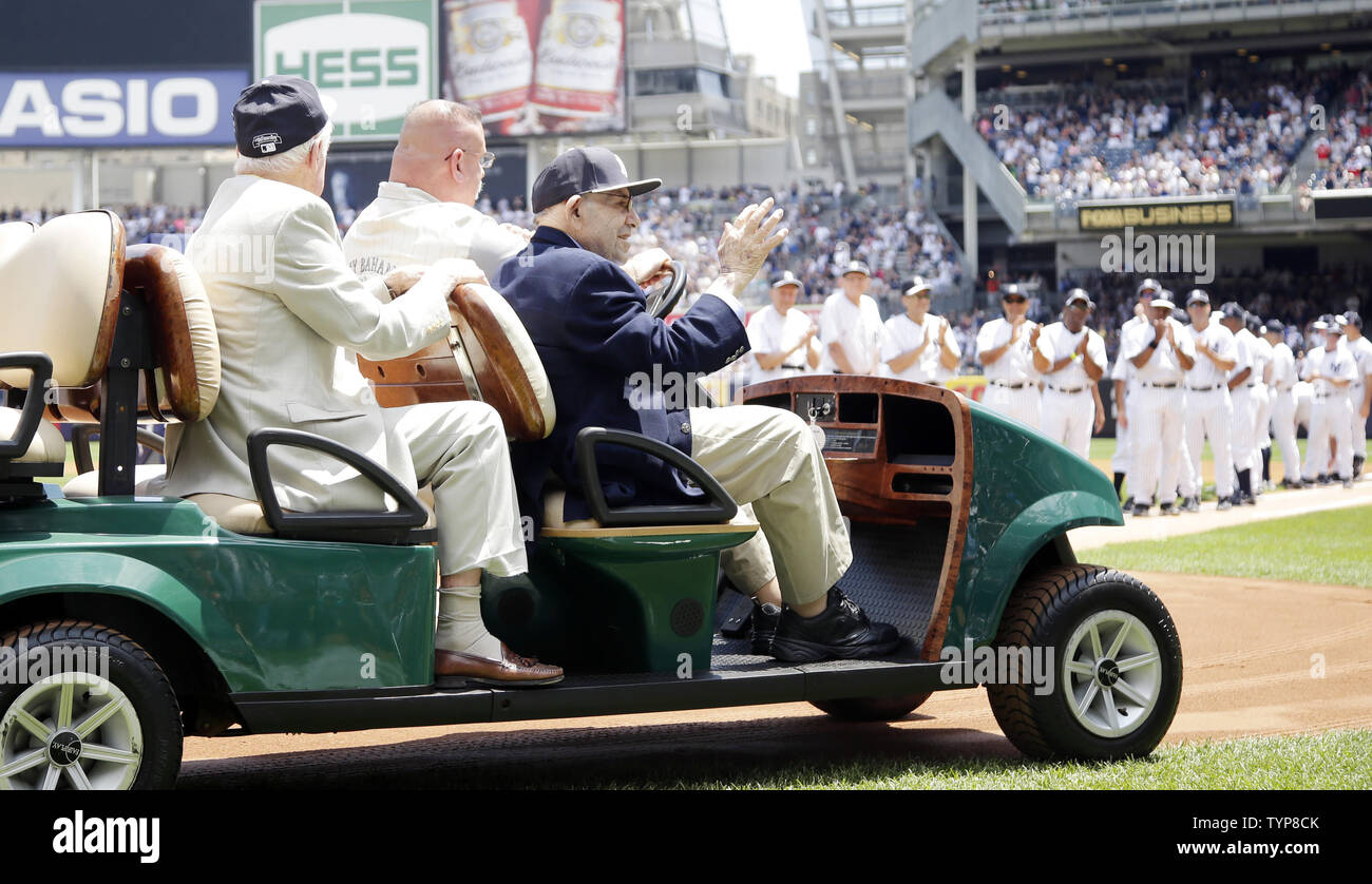 Retired New York Yankees players watch Hall of Fame Yankee player Yogi Berra wave to the crowd when he is introduced at the 68th Annual Old-Timers' Day before the New York Yankees play the Baltimore Orioles at Yankee Stadium in New York City on on June 22, 2014.   UPI/John Angelillo Stock Photo