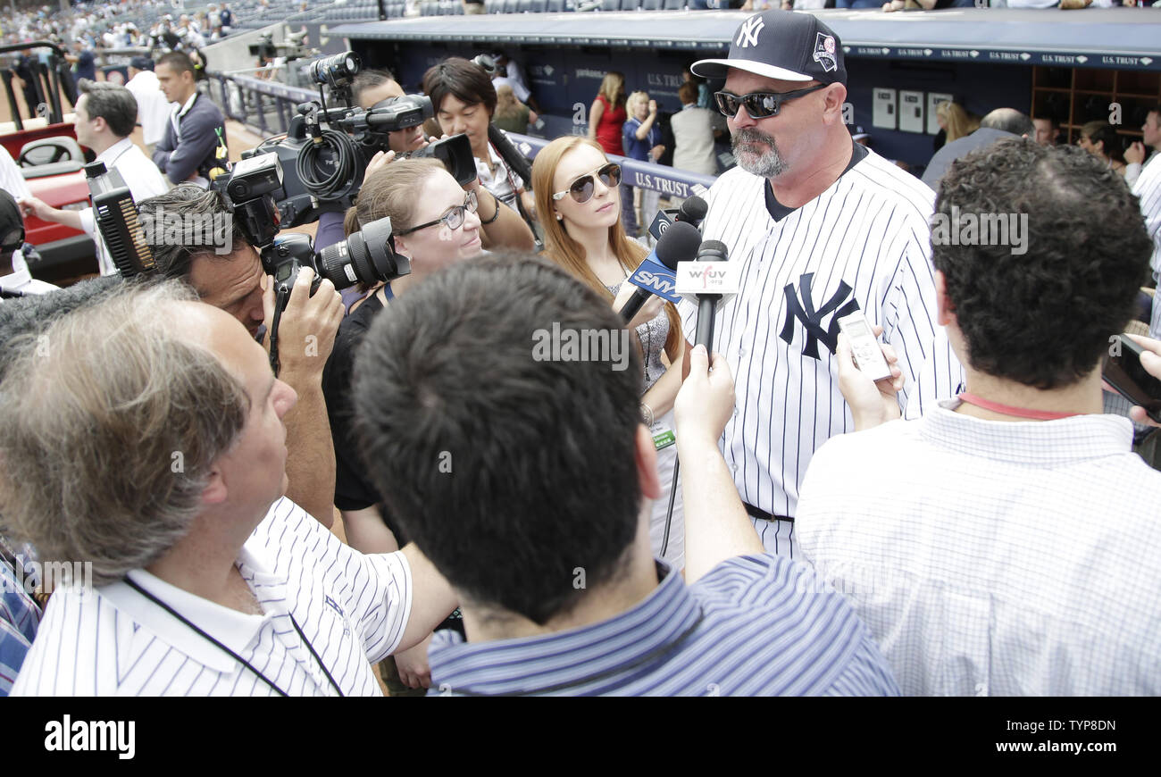 Retired New York Yankee pitcher Goose Gossage hugs Diana Munson